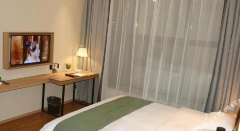 Bed in GreenTree Inn Wuxi Quanshan Center
