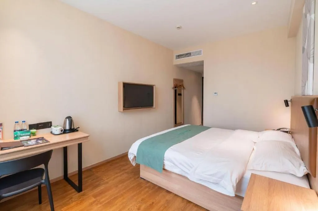 Bed in GreenTree Inn Wuxi Quanshan Center