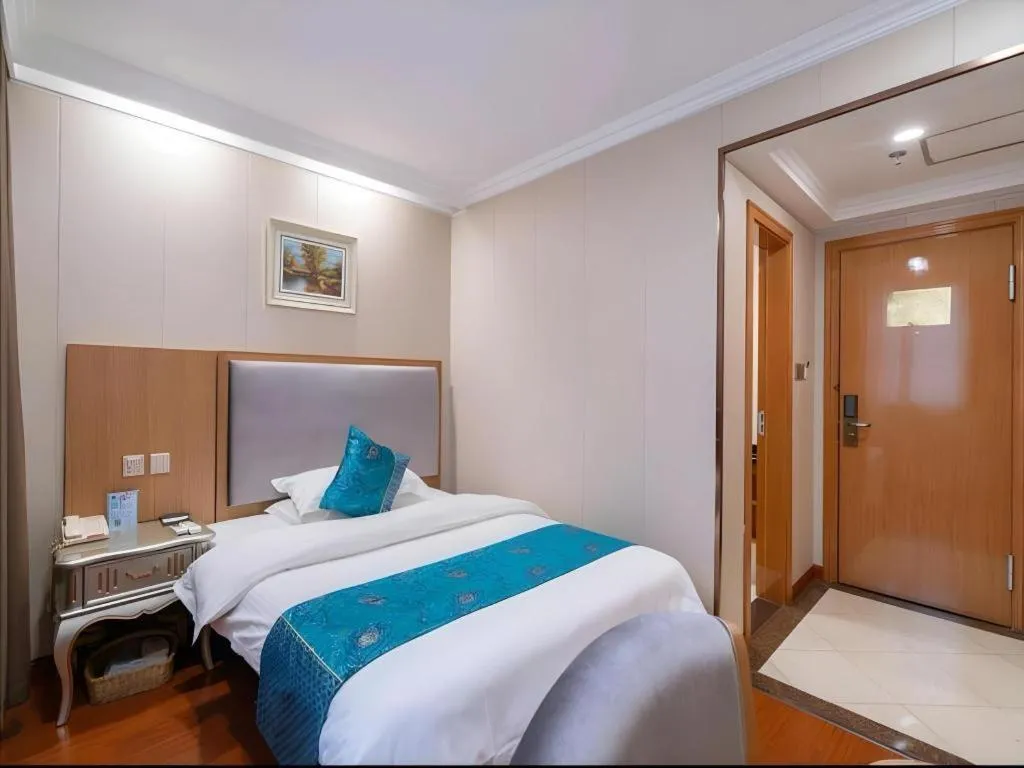 Bed in GreenTree Inn Wuxi Xinwu District Meicun Town Taibo Avenue
