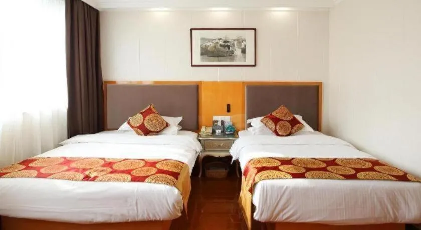 Bed in GreenTree Inn Wuxi Xinwu District Meicun Town Taibo Avenue