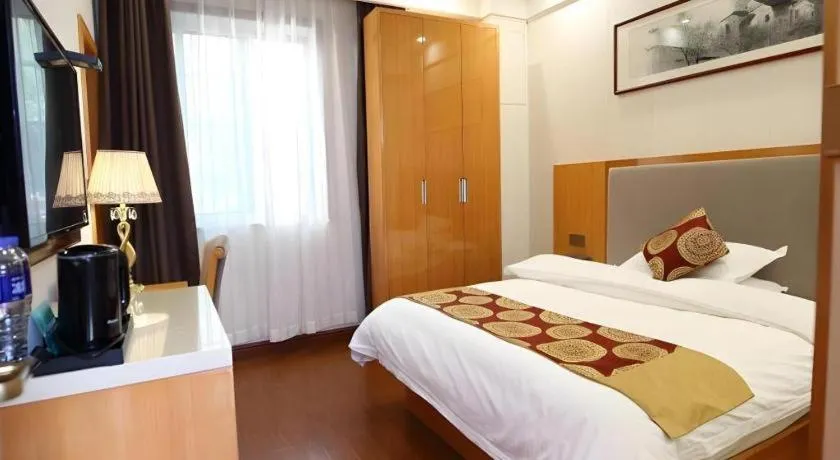 Bed in GreenTree Inn Wuxi Xinwu District Meicun Town Taibo Avenue