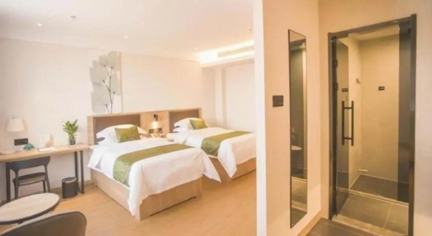 Bed in GreenTree Inn Express Taizhou Jiangyan Hardware City