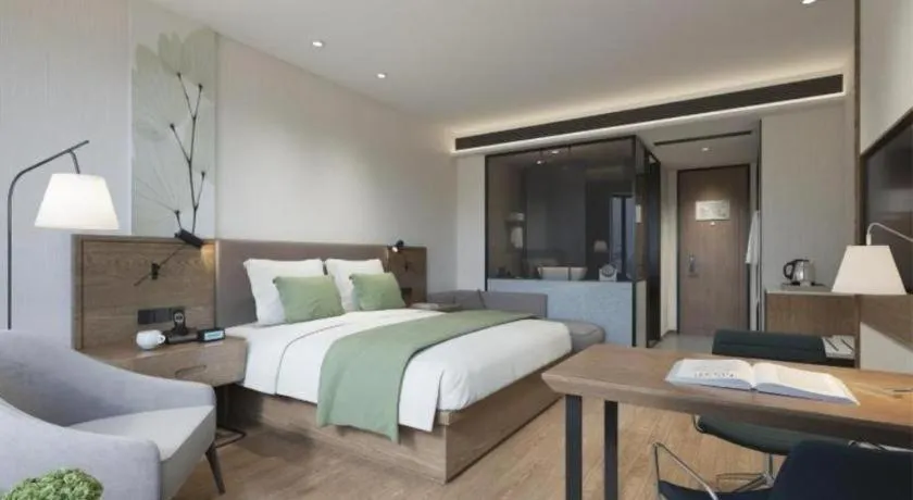 Bed in GreenTree Inn Express Taizhou Jiangyan Hardware City