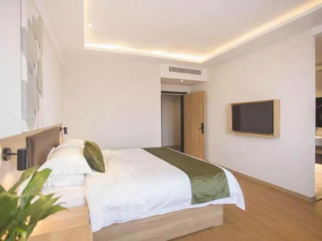 Bed in GreenTree Inn Express Taizhou Jiangyan Hardware City