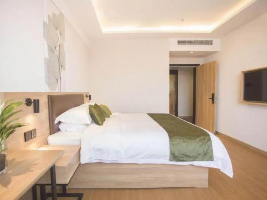 Bed in GreenTree Inn Express Taizhou Jiangyan Hardware City
