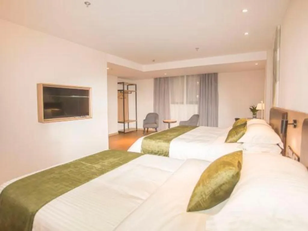 Bed in GreenTree Inn Express Taizhou Jiangyan Hardware City