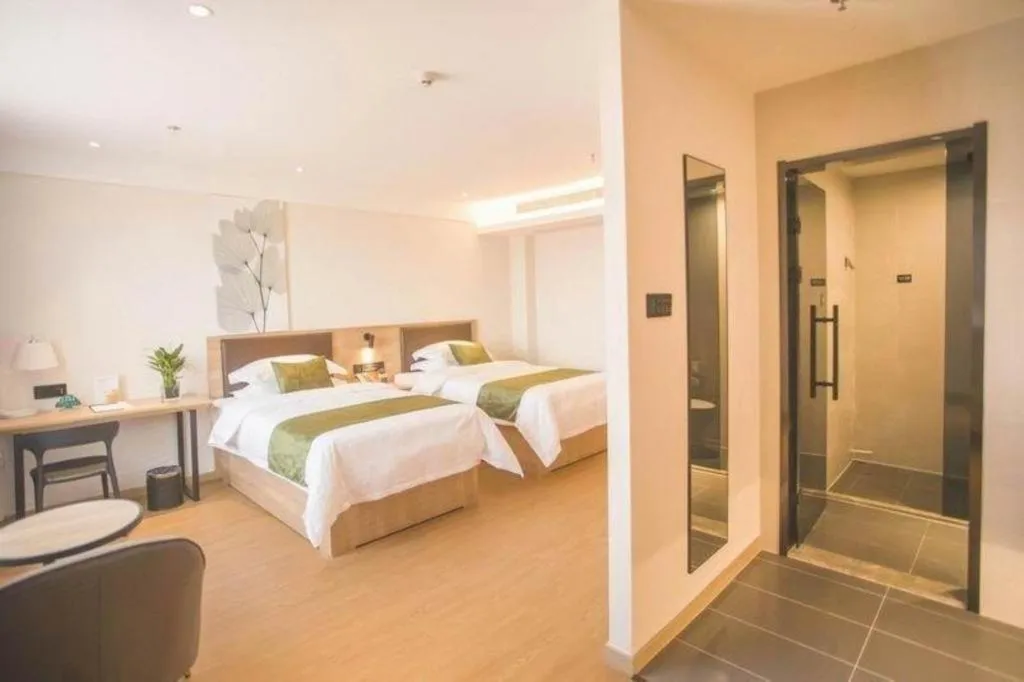 Bed in GreenTree Inn Express Taizhou Jiangyan Hardware City