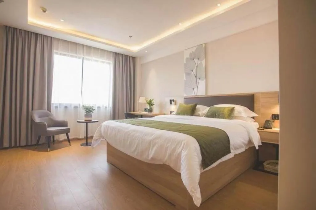 Bed in GreenTree Inn Express Taizhou Jiangyan Hardware City