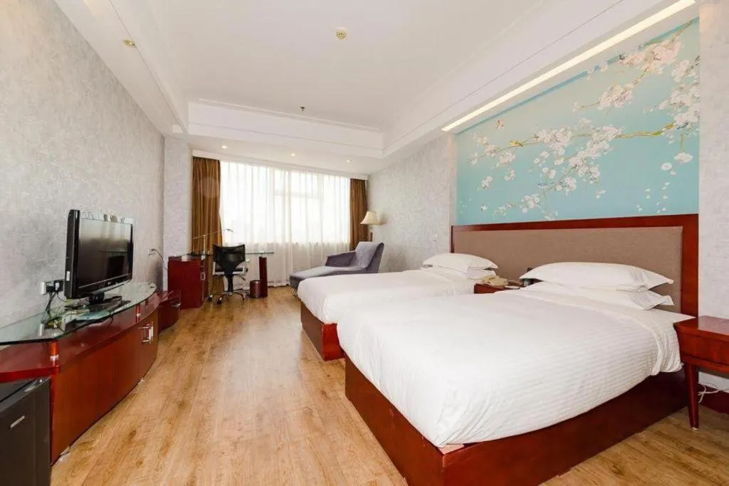 Bed in Junyu Grand Hotel Qinhuangdao