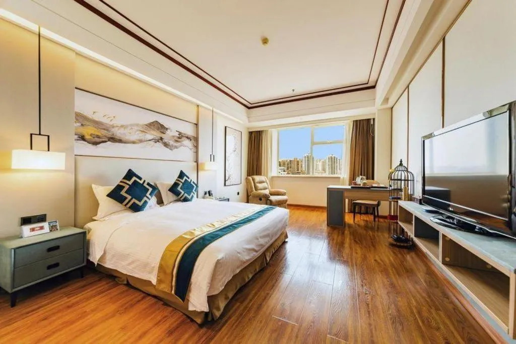 Bed in Junyu Grand Hotel Qinhuangdao