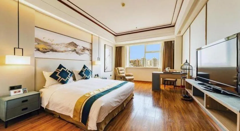 Bed in Junyu Grand Hotel Qinhuangdao