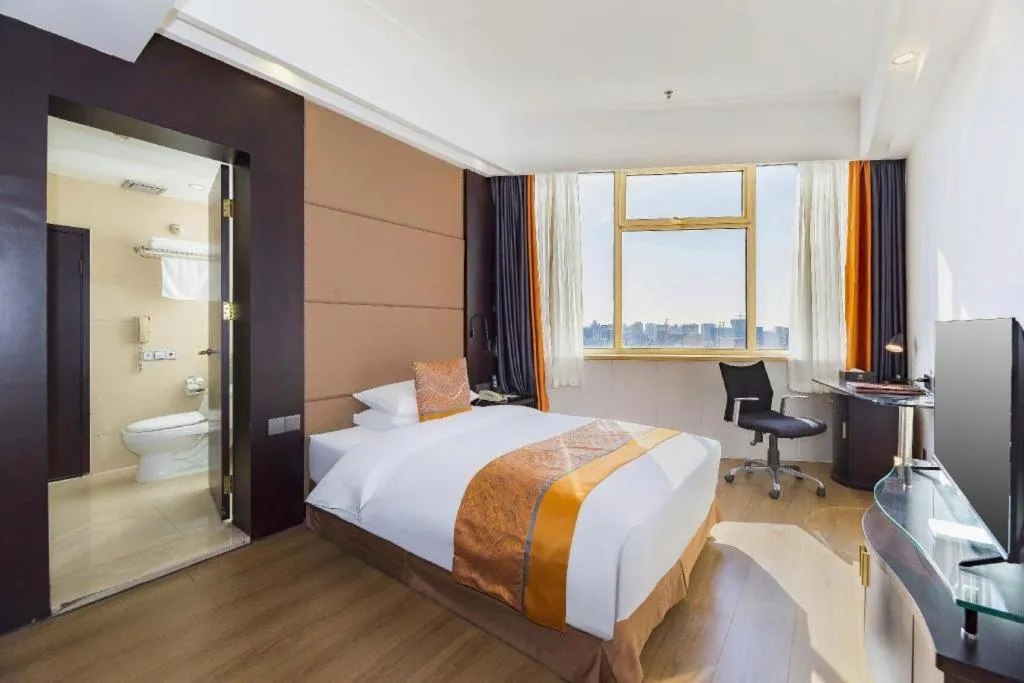 Bed in Junyu Grand Hotel Qinhuangdao