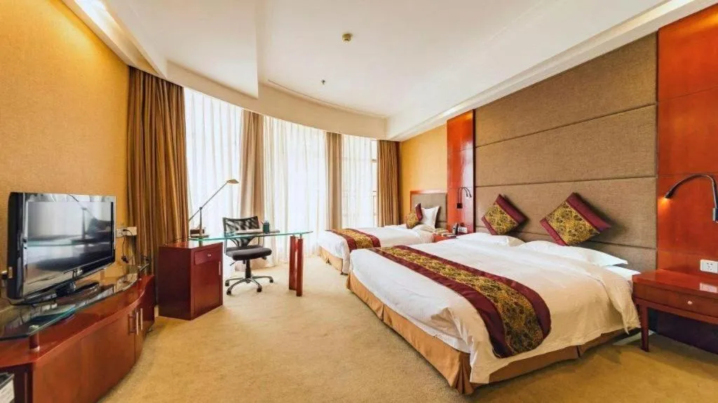 Bed in Junyu Grand Hotel Qinhuangdao