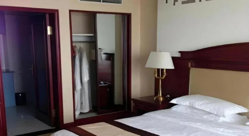 Bed in Heilongjiang Kunlun Hotel