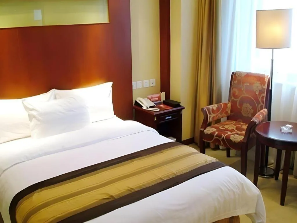 Bed in Heilongjiang Kunlun Hotel