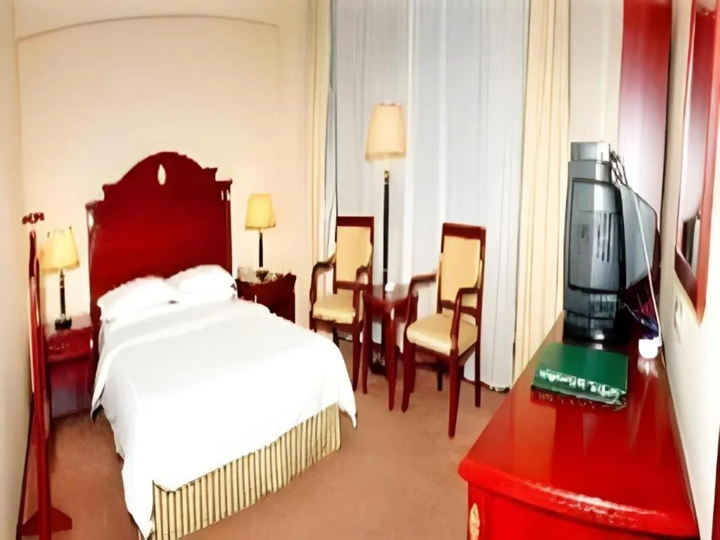 Bed in Heilongjiang Kunlun Hotel