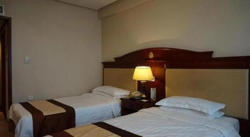 Bed in Heilongjiang Kunlun Hotel