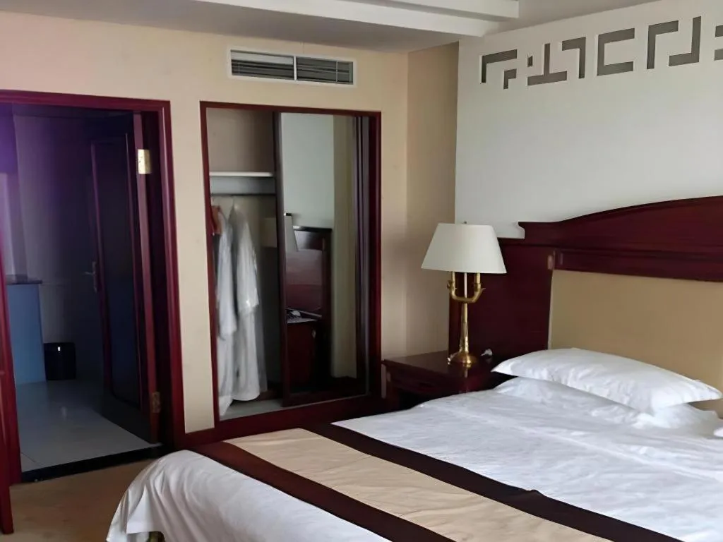 Bed in Heilongjiang Kunlun Hotel