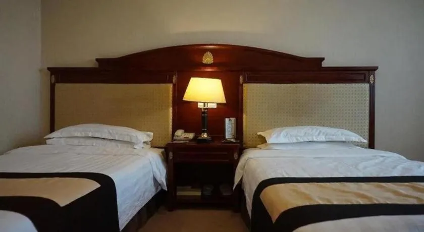Bed in Heilongjiang Kunlun Hotel