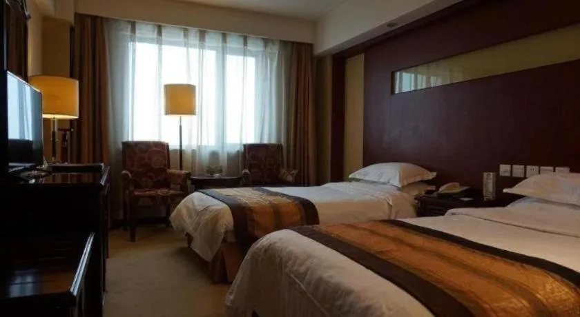 Bed in Heilongjiang Kunlun Hotel