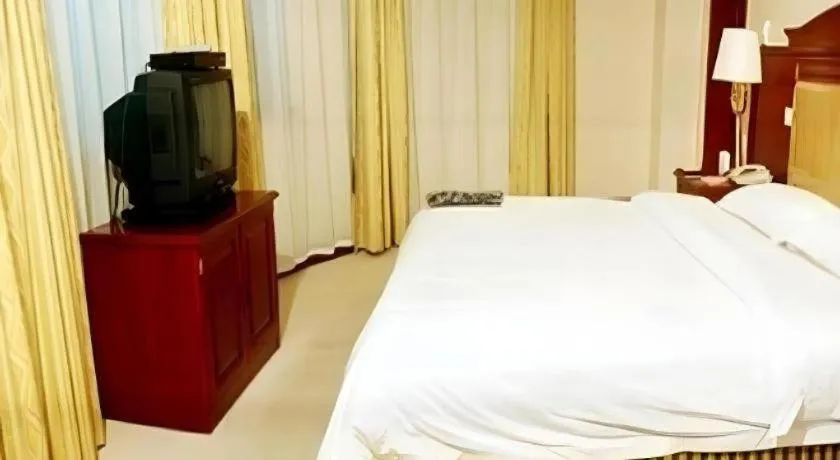 Bed in Heilongjiang Kunlun Hotel
