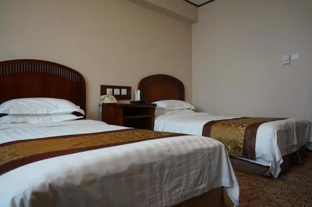 Bed in Heilongjiang Kunlun Hotel