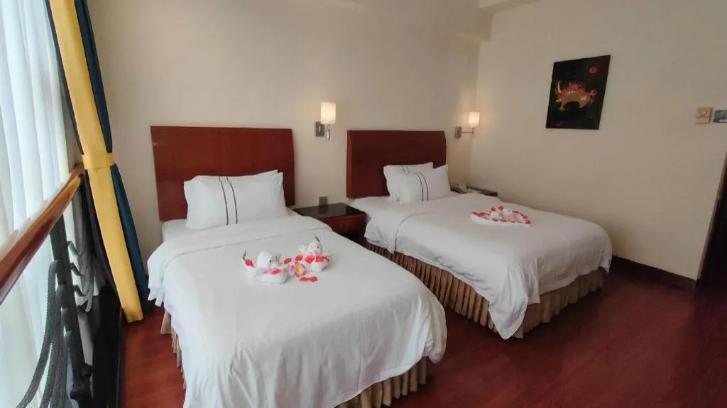 Bed in Xinyuan Hot Spring Hotel