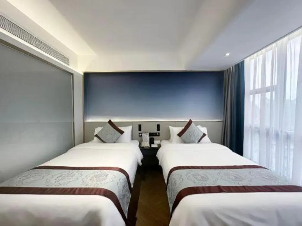 Bed in Xinyuan Hot Spring Hotel