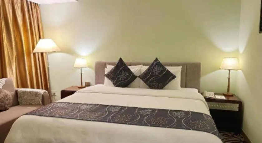 Bed in Xinyuan Hot Spring Hotel