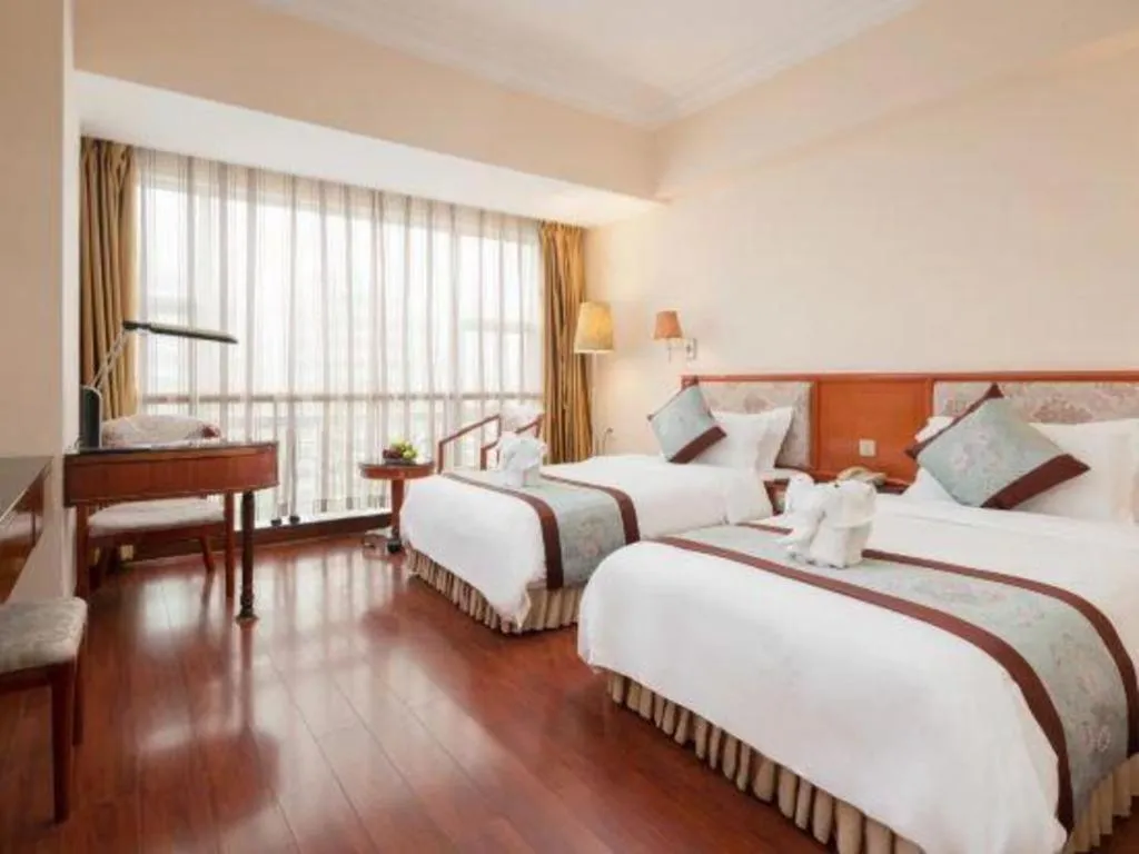 Bed in Xinyuan Hot Spring Hotel