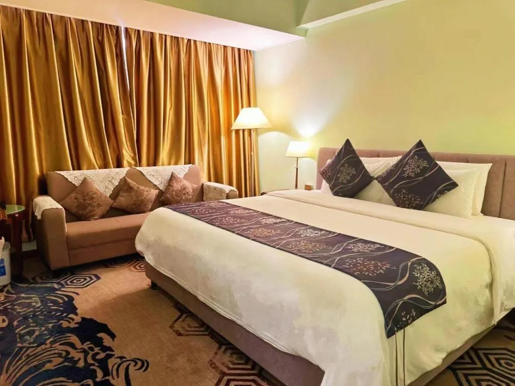 Bed in Xinyuan Hot Spring Hotel