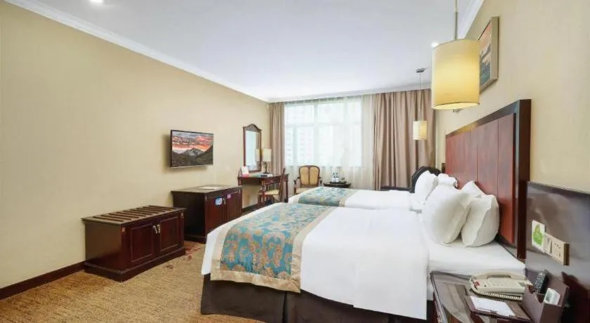 Bed in Sun Island Holiday Hotel