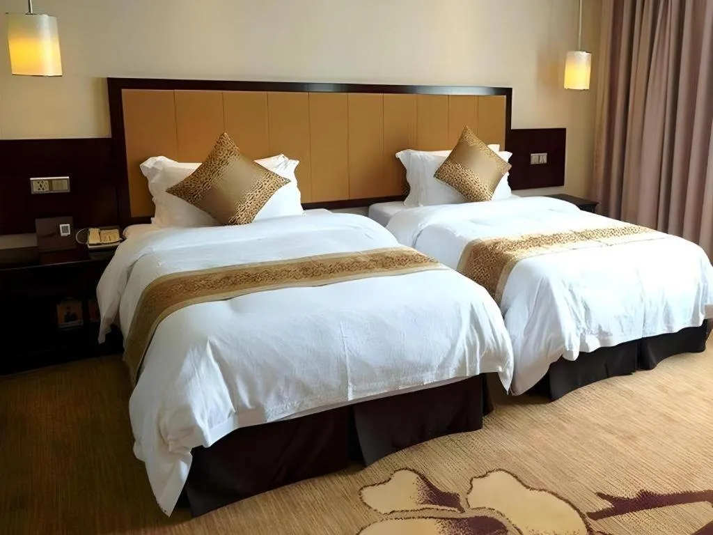 Bed in Sun Island Holiday Hotel