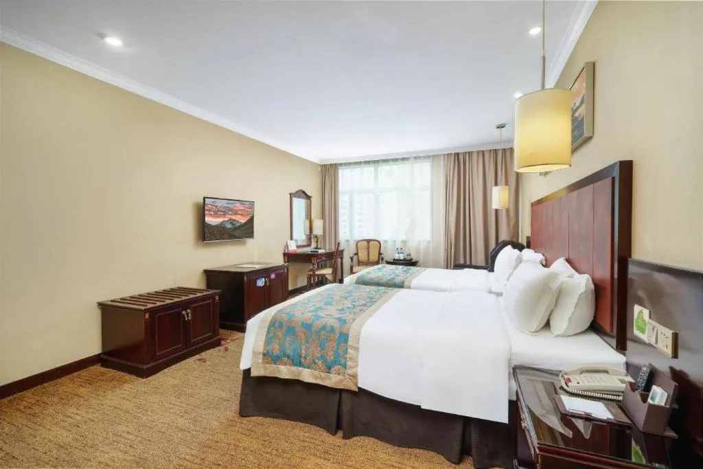 Bed in Sun Island Holiday Hotel