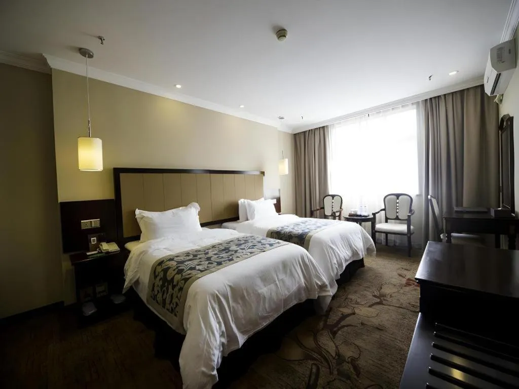 Bed in Sun Island Holiday Hotel