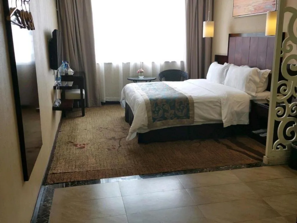 Bed in Sun Island Holiday Hotel