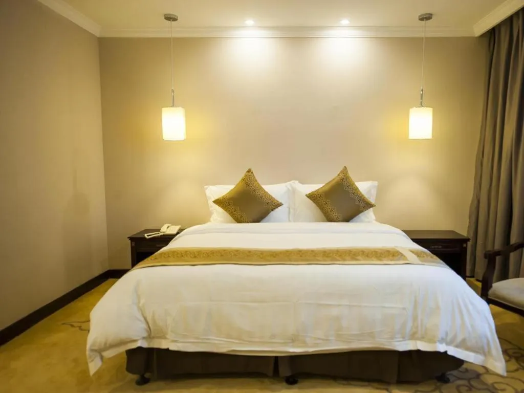 Bed in Sun Island Holiday Hotel