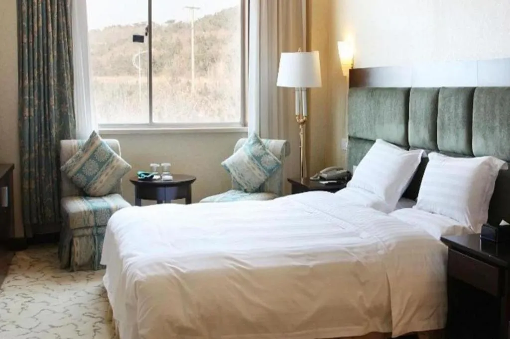 Bed in Golden Bay Hotel Weihai