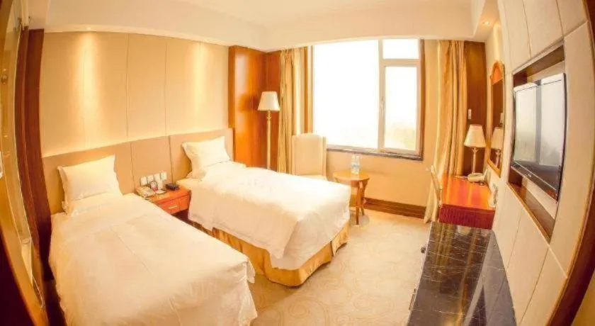 Bed in Golden Bay Hotel Weihai