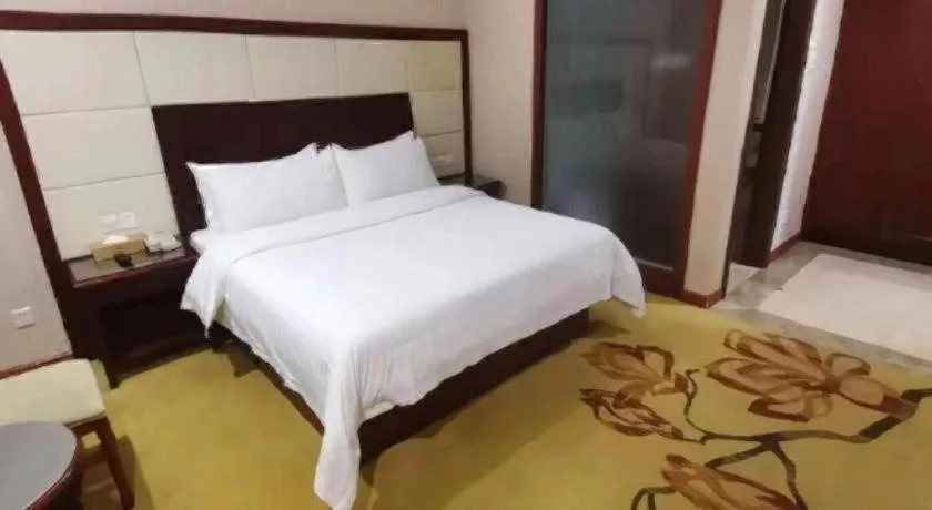 Bed in Vienna International Hotel Shanghai Songjiang Branch