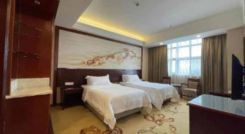 Bed in Vienna International Hotel Shanghai Songjiang Branch