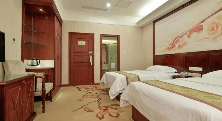 Bed in Vienna International Hotel Shanghai Songjiang Branch