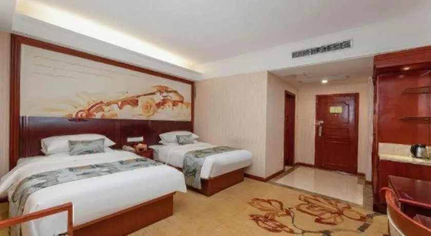 Bed in Vienna International Hotel Shanghai Songjiang Branch