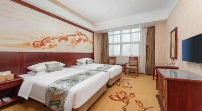 Bed in Vienna International Hotel Shanghai Songjiang Branch