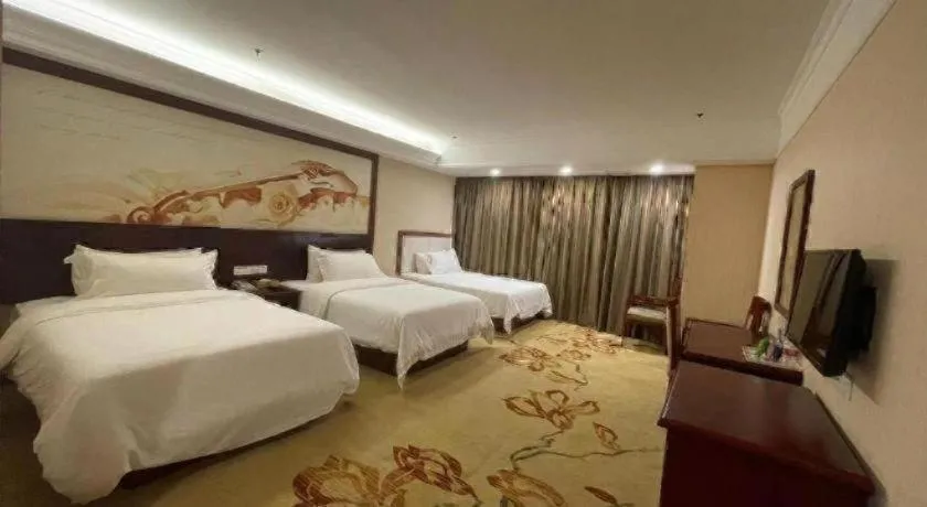 Bed in Vienna International Hotel Shanghai Songjiang Branch