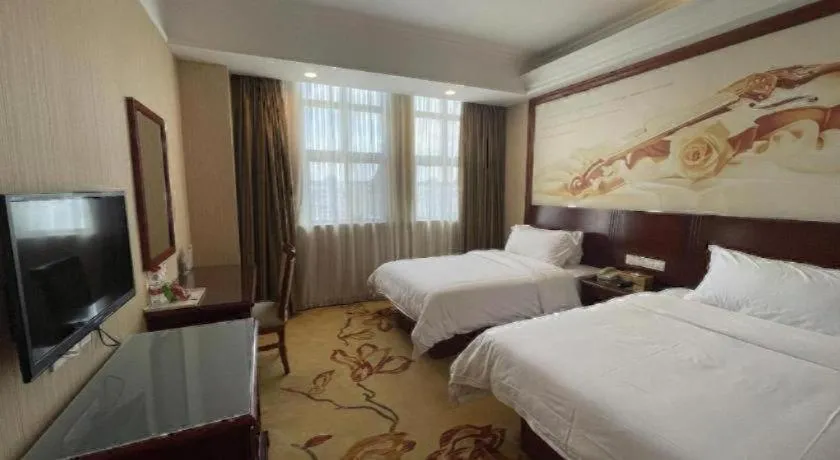 Bed in Vienna International Hotel Shanghai Songjiang Branch