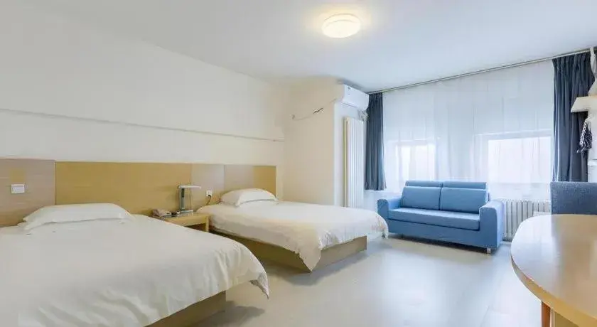 Bed in Jinjiang Inn Qingdao Wuxi Square Nanjing Road Metro Station Bed in Jinjiang Inn Qingdao Wuxi Square Nanjing Road Metro Station