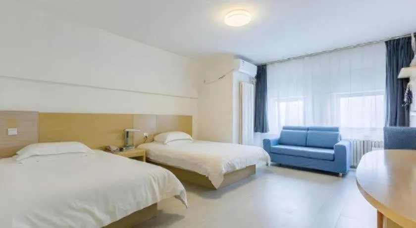 Bed in Jinjiang Inn Qingdao Wuxi Square Nanjing Road Metro Station