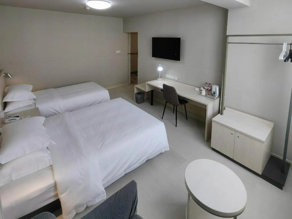 Bed in Jinjiang Inn Qingdao International Exhibition Center Haier Road