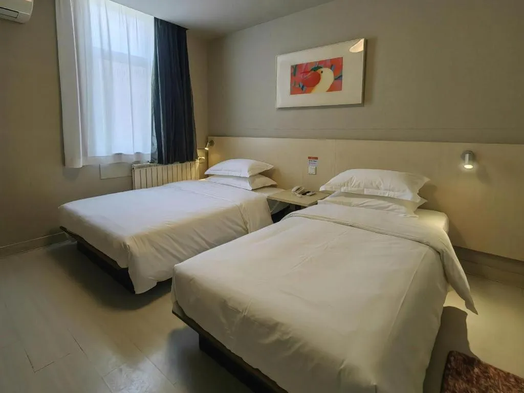 Bed in Jinjiang Inn Qingdao International Exhibition Center Haier Road